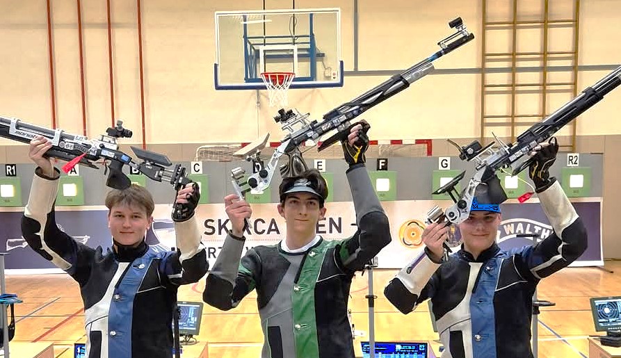 Slovenian junior sport shooters Gal Potrč, Maksimilijan Žarić, and Florjan Klemenčič celebrating a win.