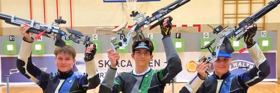 Slovenian junior sport shooters Gal Potrč, Maksimilijan Žarić, and Florjan Klemenčič celebrating a win.