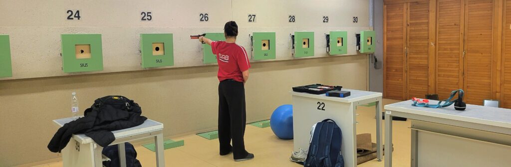 Tea Mikec doing dry-fire exercises on the wall of the shooting range