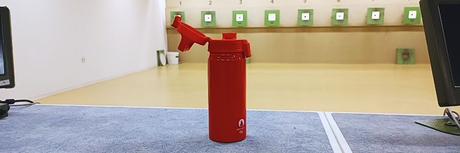 A water bottle with a flip-open lid is best to shield the lip or the spout from any dust, dirt, or lead particles in the ear.